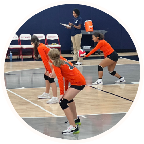 volleyball team in the middle of a game