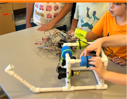 robotics students building