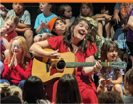 Teacher Singing in the Black Box Theater